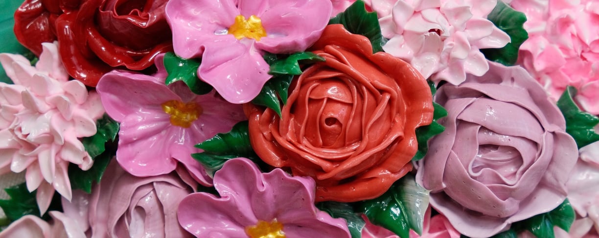 a bouquet of flowers that is decorated with pink and purple flowers