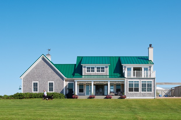 a photo of an east coast home with a green metal roof