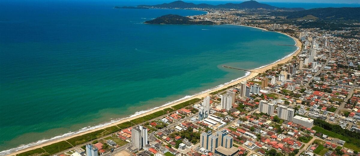 a cityscape of a beach with a view of the ocean