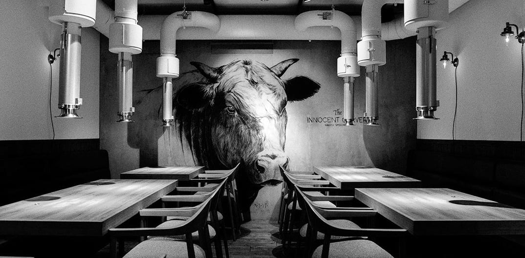 a bull head on mural painting in a restaurant, Tokyo