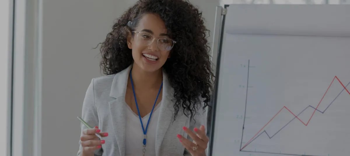 woman at a meeting showing growth strategy to clients