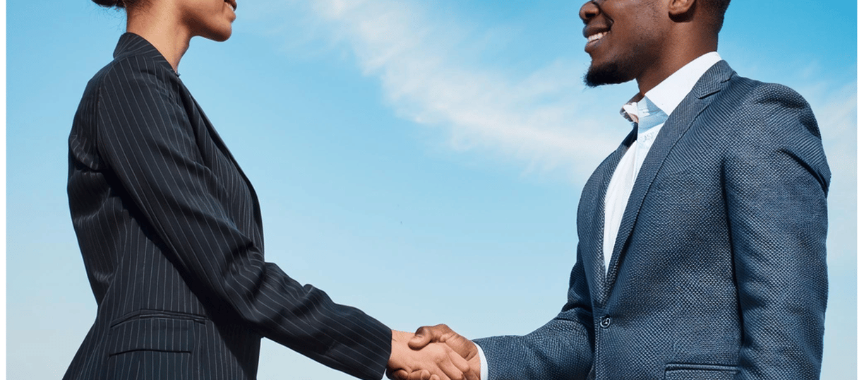 Deux personnes se serrant la main, symbolisant la collaboration et l’engagement