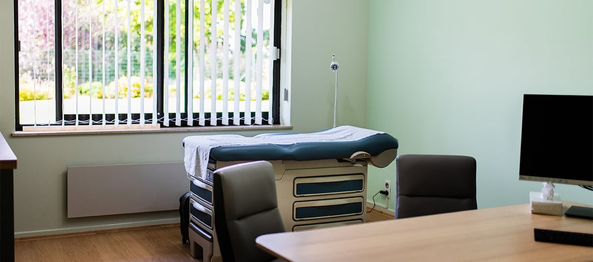 a room with a bed and a desk
