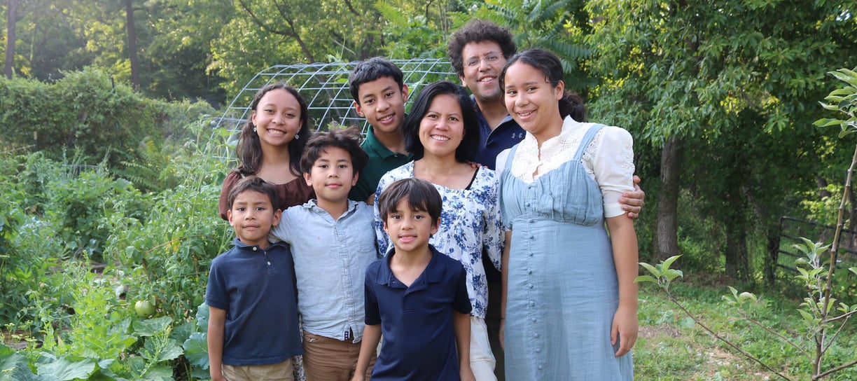 The Schauder Family in front of their garden. 