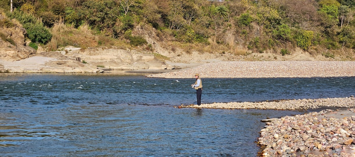 Fishing in a Himalayan river in Himachal Pradesh.
