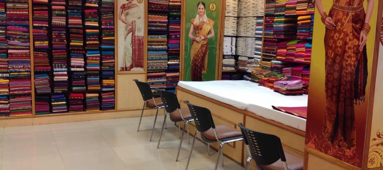 Sree Vijayalakshmi Silks showroom interior with vibrant silk sarees and elegant ethnic collections.