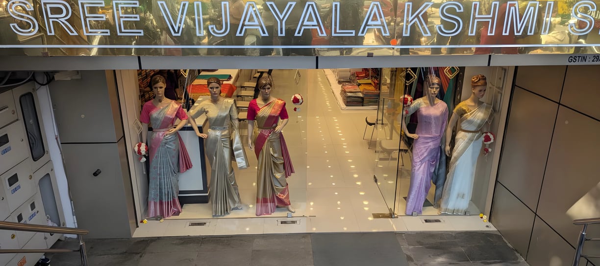Elegant Sree Vijayalakshmi Silks Jayanagar store front showcasing premium silk sarees for weddings.