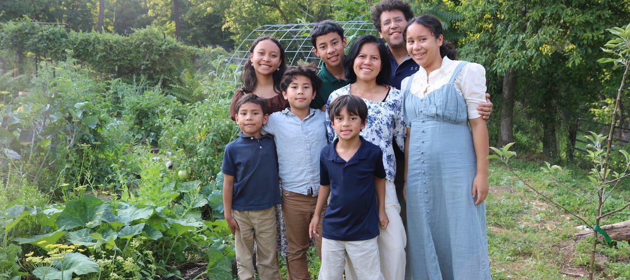 The Schauder Family in front of their garden. 