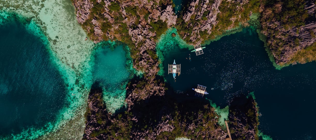 a couple of boats are in the water