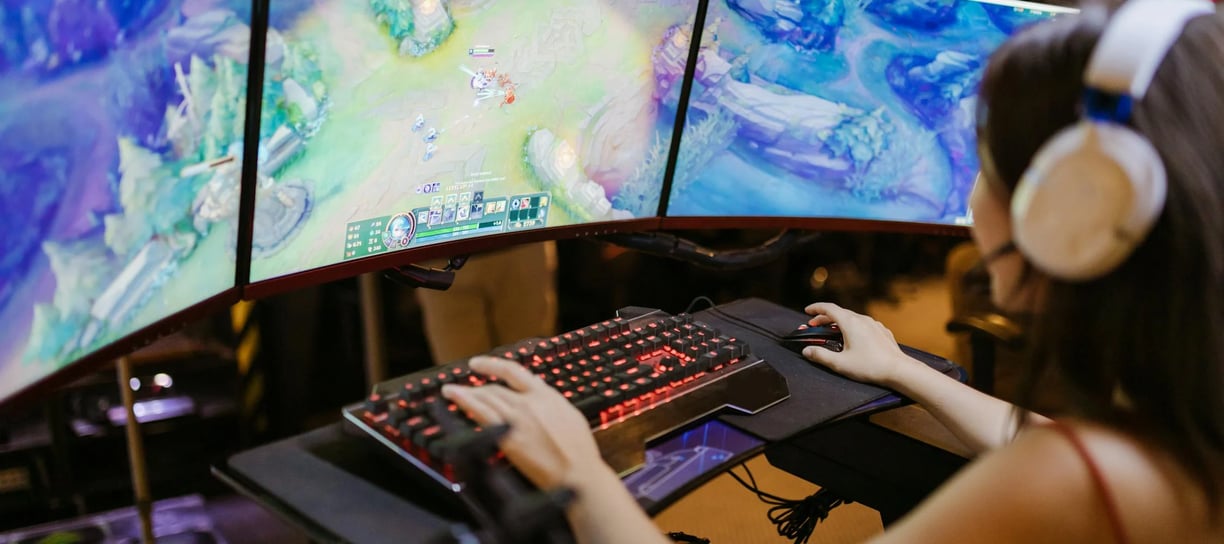a woman playing a video game on a computer screen