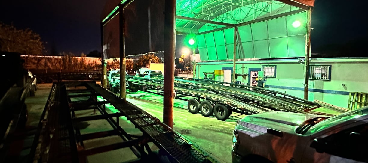 General view of Truck & Trailer Services repair station at night