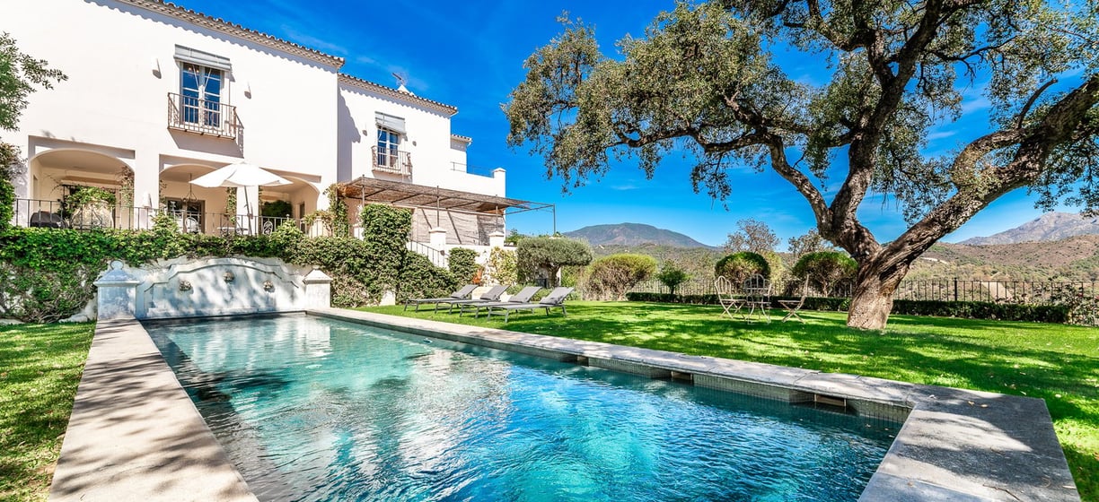 A beautiful pool surrounded by oak trees at Finca Santa Katerina