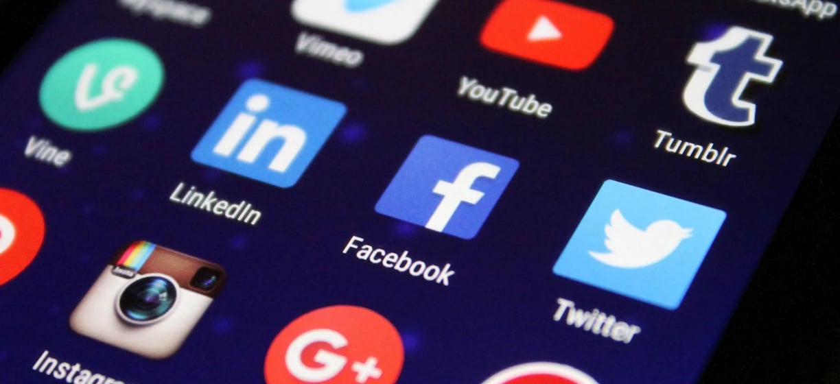 a cell phone with a bunch of social media icons