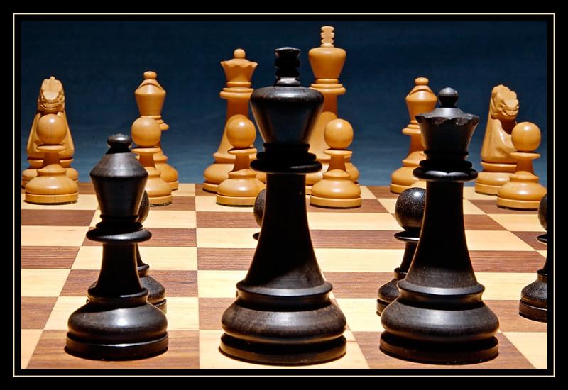 a chess game with a chess board and chess pieces