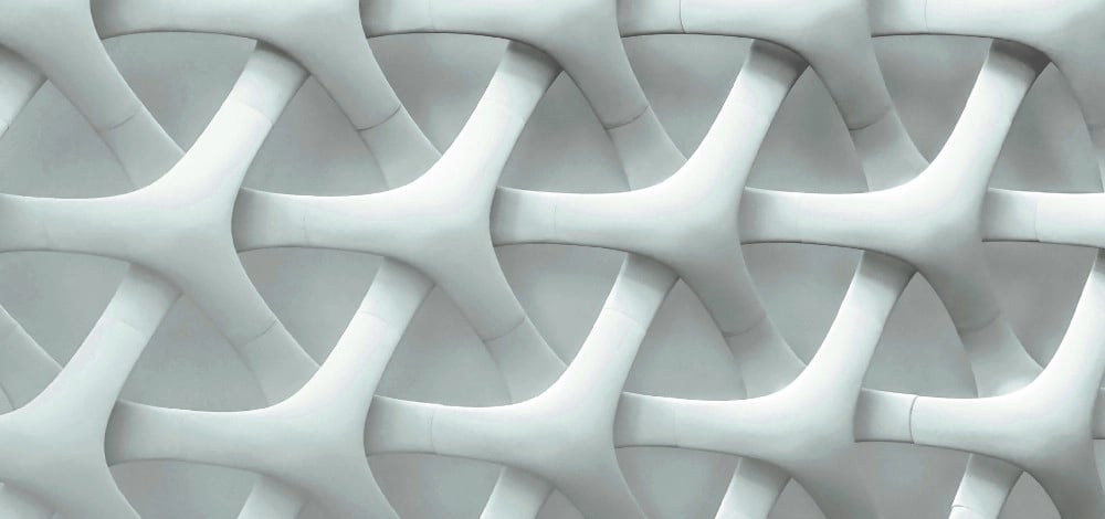 a wall of white and grey colored tiles