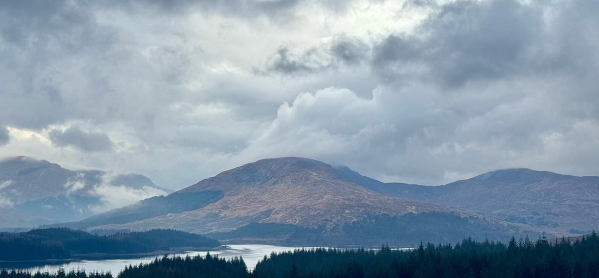 Beautiful peaceful moody scene of hills and river