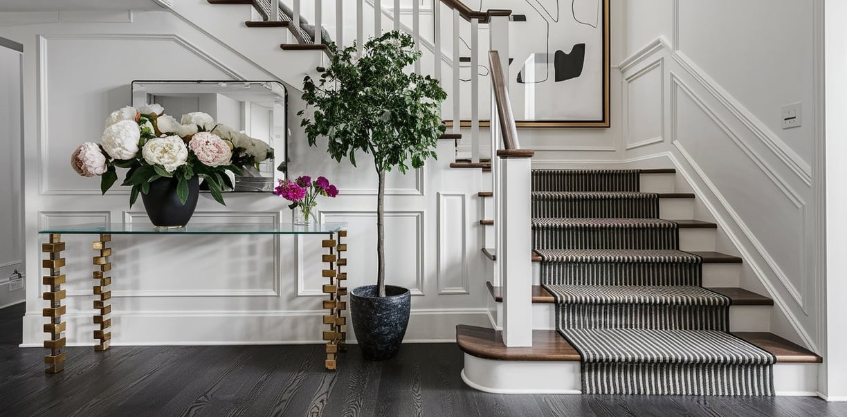 a staircase way with a vase of flowers in a vase