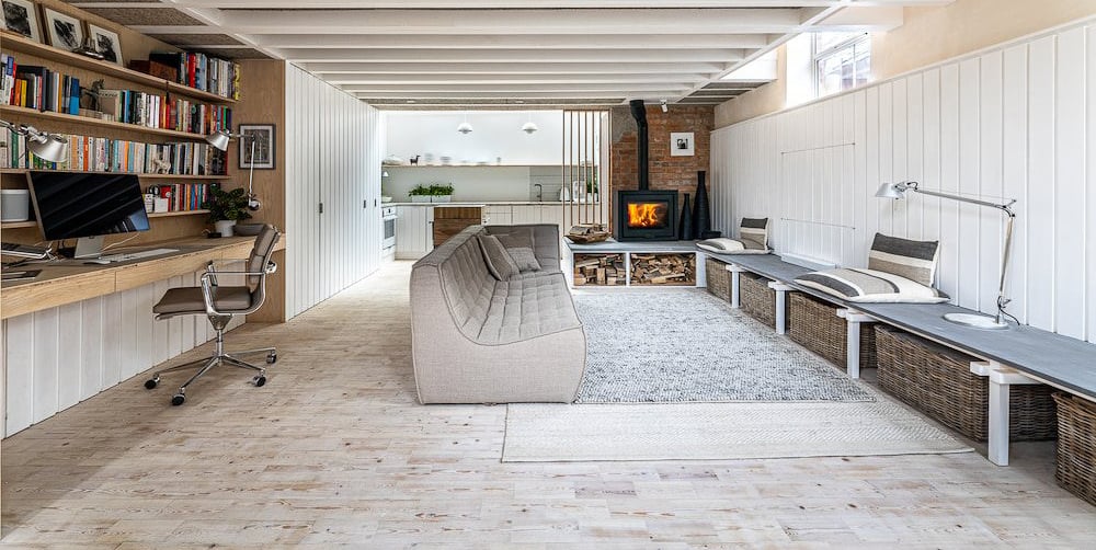 a living room with a couch and a desk