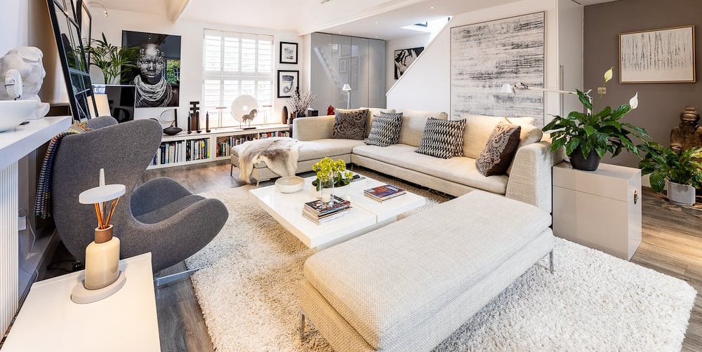 a living room with a couch and a fireplace