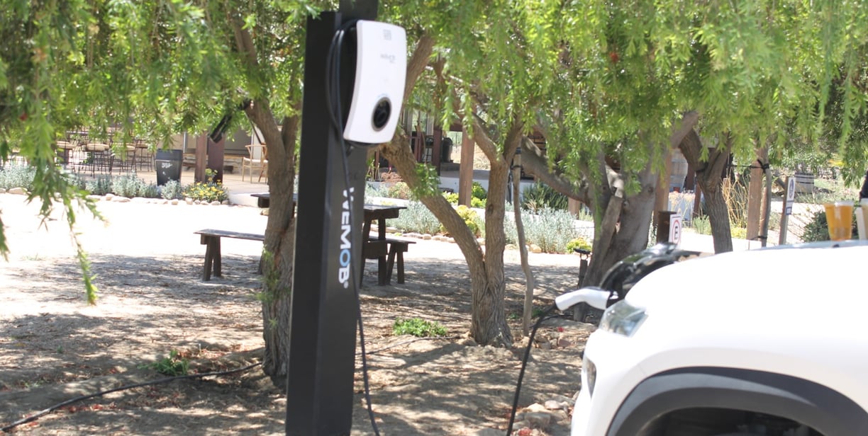 a car charging station with a charging station attached to it