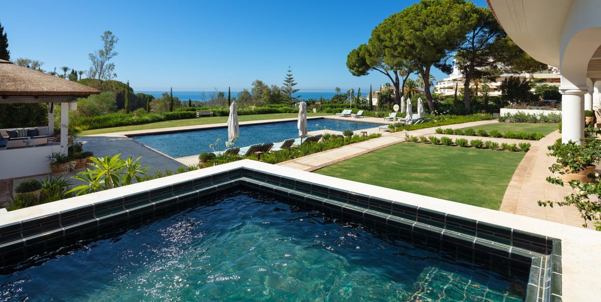 Garden, pool, and Mediterranean views from the pool house at Villa La Gratitud.