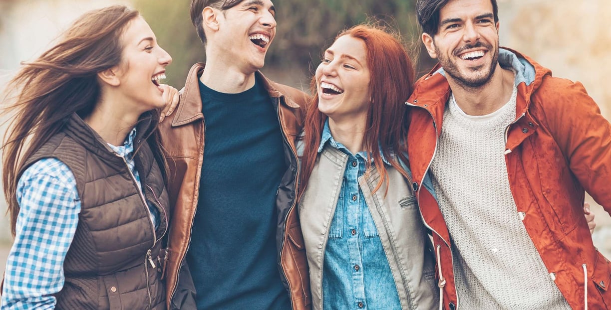 a group of friends laughing and laughing together