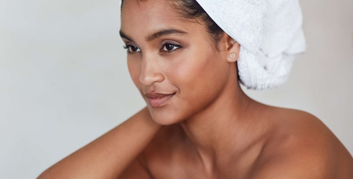 a woman with a towel on her head