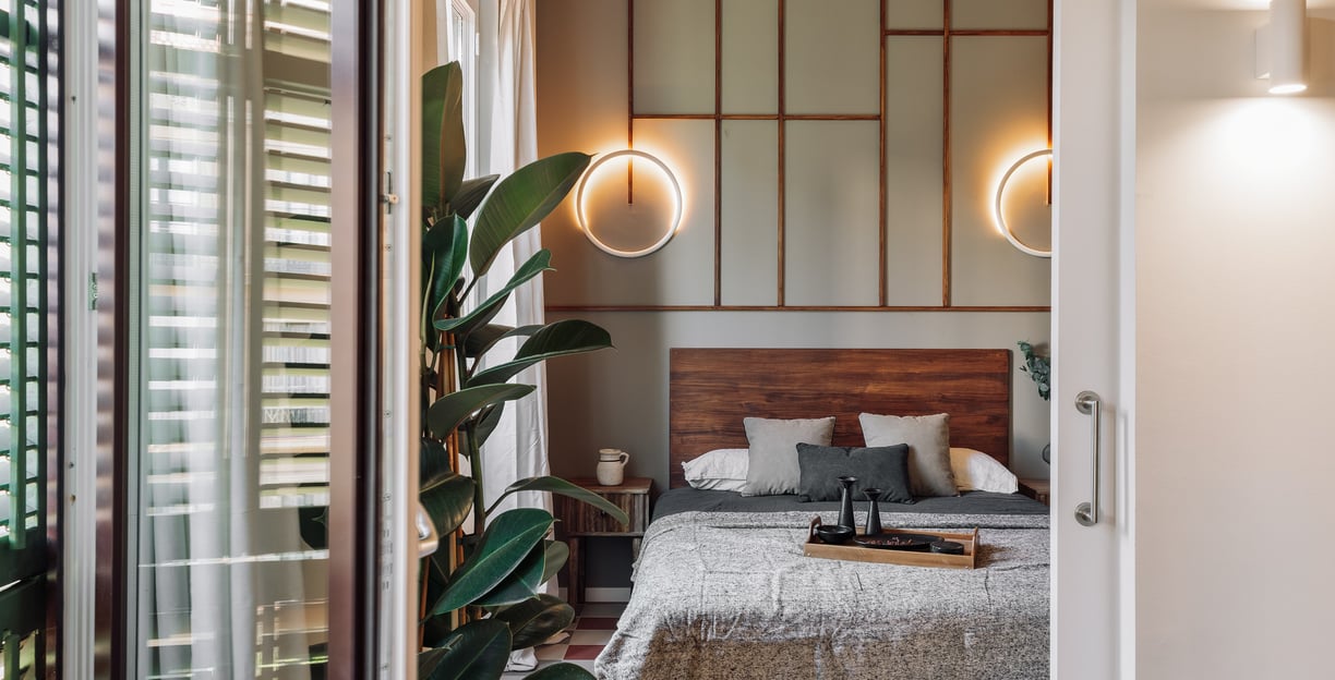 Relaxing bedroom with natural wood finishes, neutral tones, and minimalist design in Barcelona