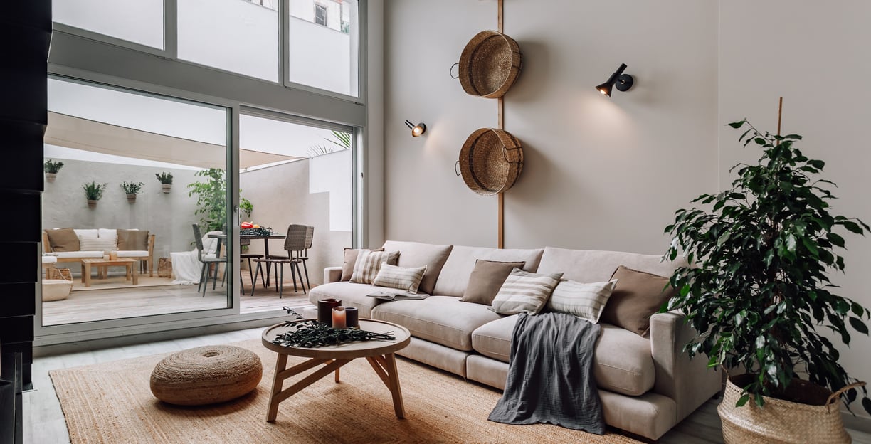 Cozy outdoor terrace with seating and sofa and natural textures in Barcelona residential design