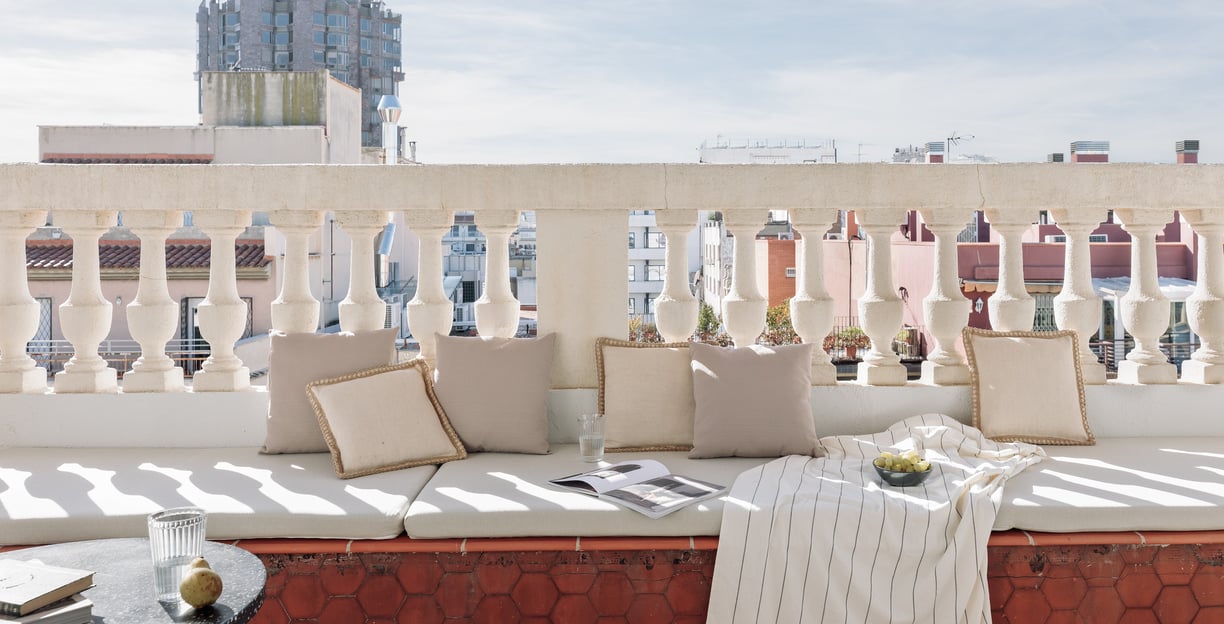 Sunny private terrace with elegant decor and views in Barcelona apartment