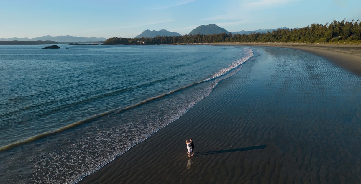 Couple eloping on Chesterman beach in Tofino, British Columbia.