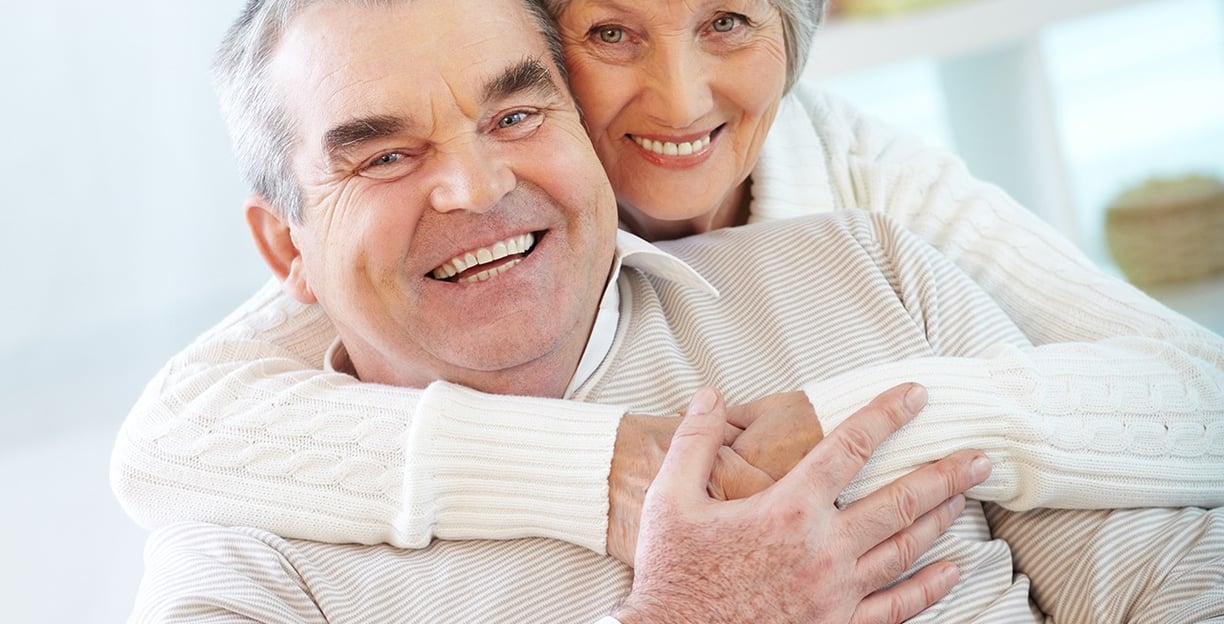 elderly couple smiling