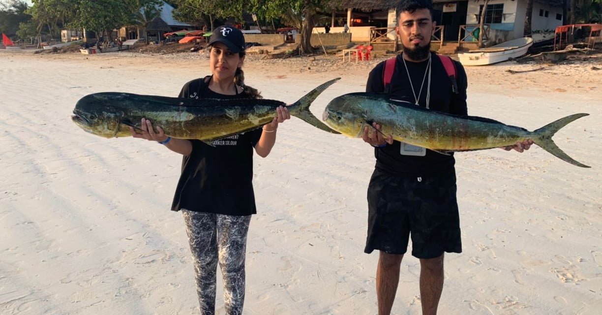Happy anglers on a Zanzibar fishing charter with Zanzibar Angler's Paradise.