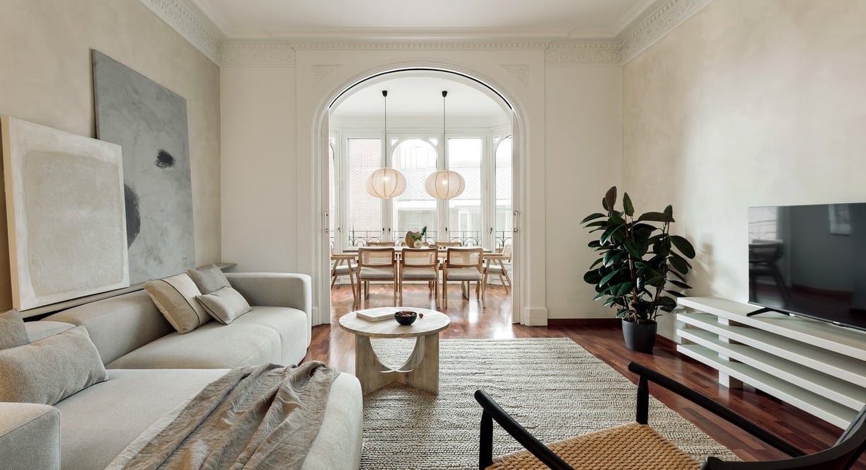 Sophisticated Living room with modern decor, natural materials, and a neutral color palette and art