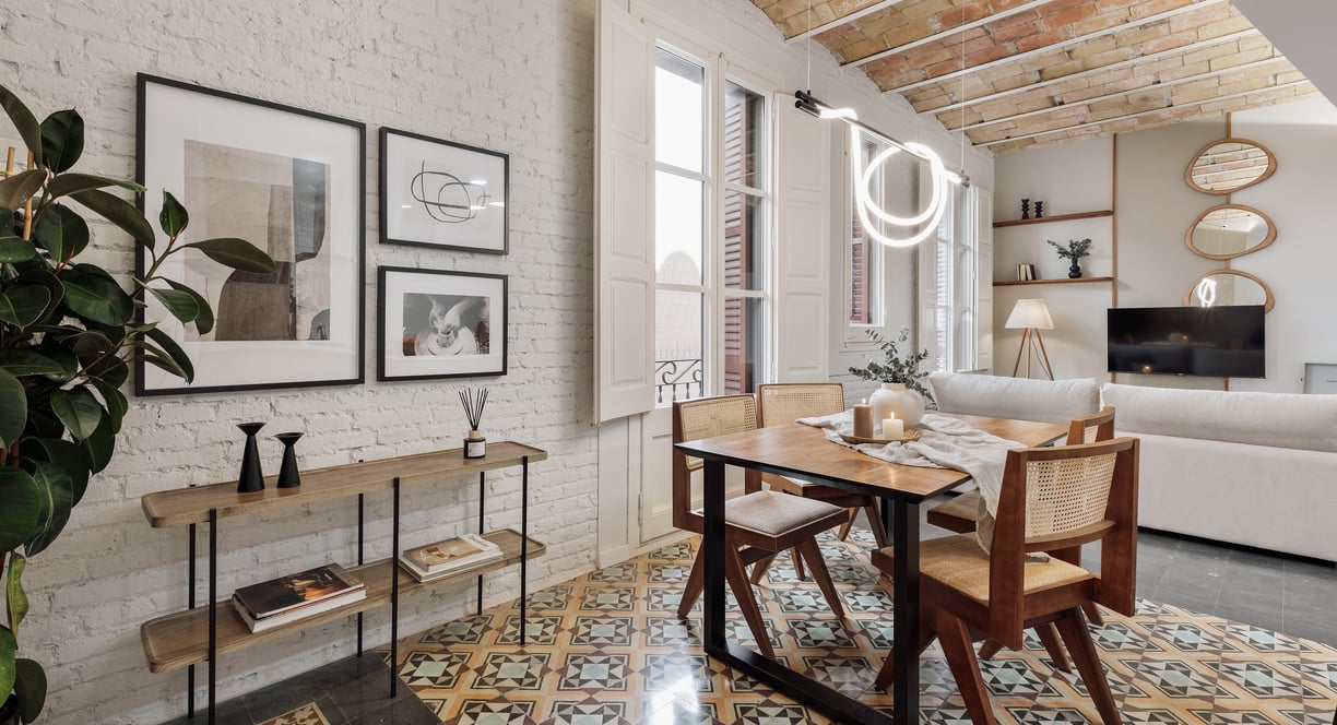 Modern dining room with exposed brick walls, tile floors and Catalan vaulted ceiling interior design