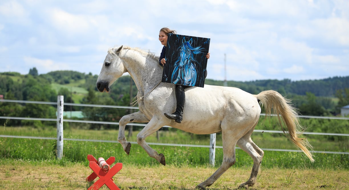 Kasia Bukowska jumping bareback and bridleless with her equine art horse painting