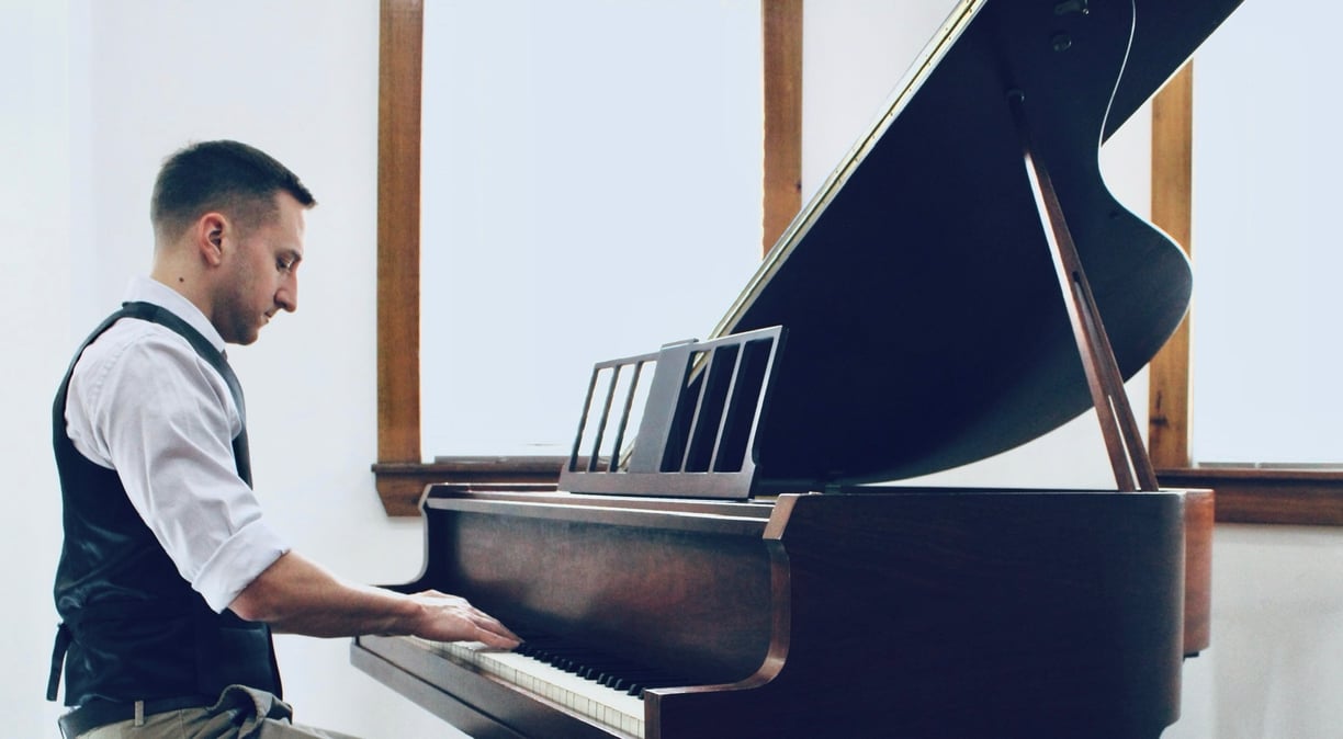 Travis Reichstein playing piano, Canadian composer