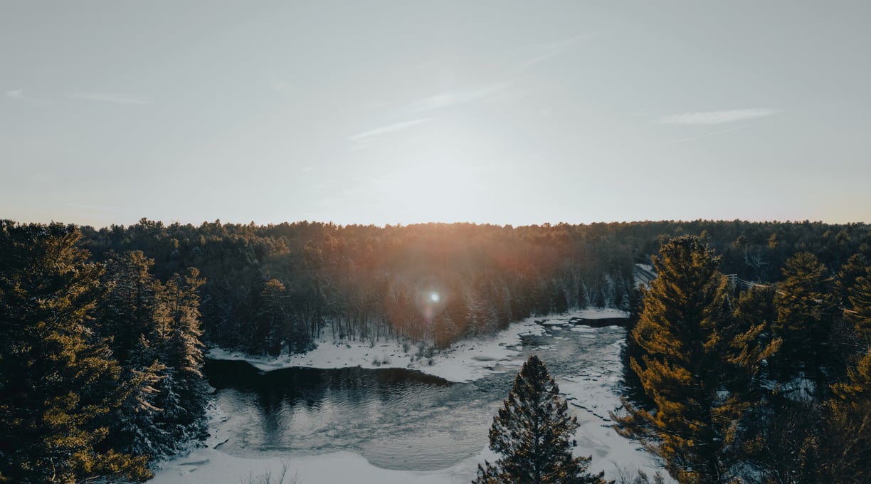 a river with a sun shining through the trees, Canada Nature