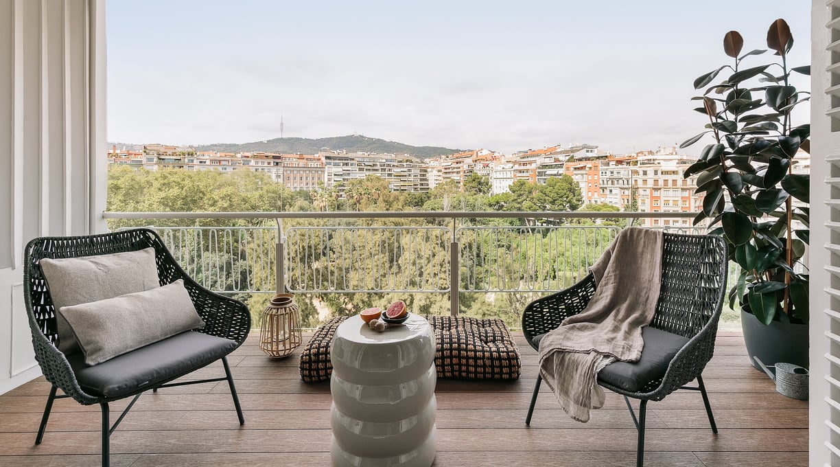 Private terrace with stunning views and outdoor seating, designed for RAMA in Barcelona Turo Park