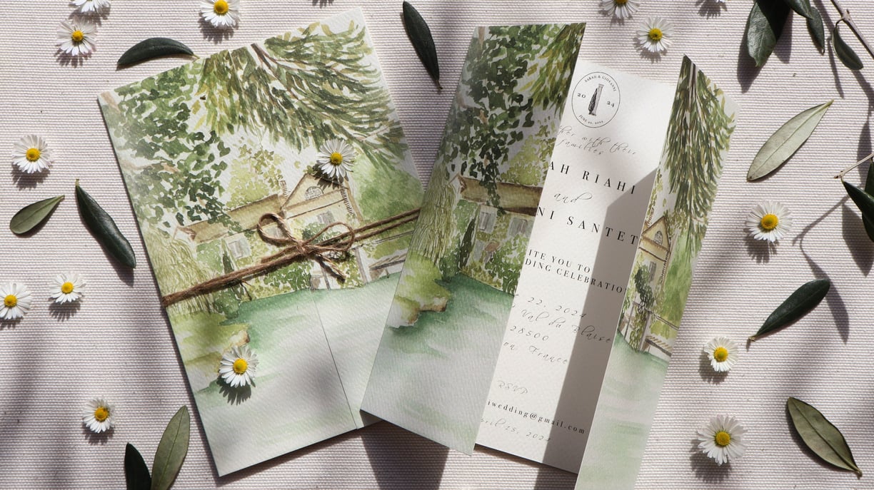 watercolor invitation of the location with flowers and olive leaves