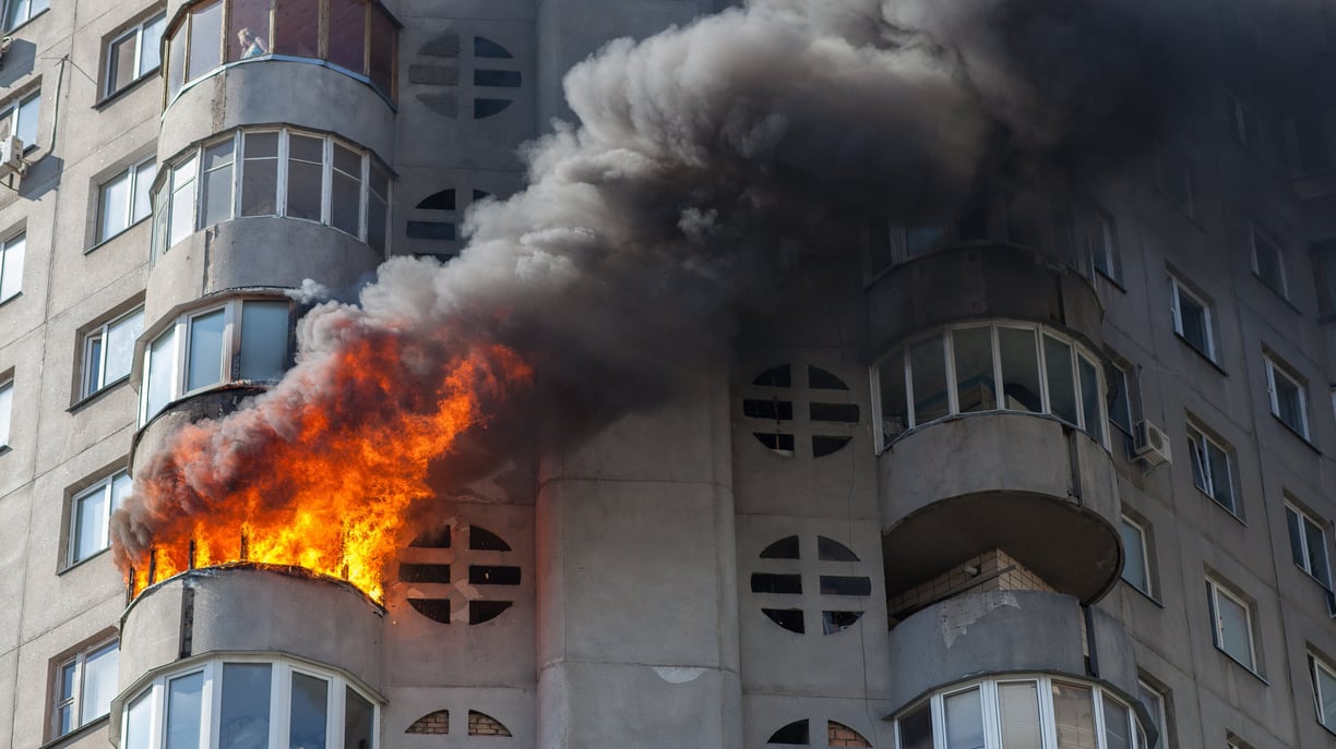 a fire is seen in a house on top of a building
