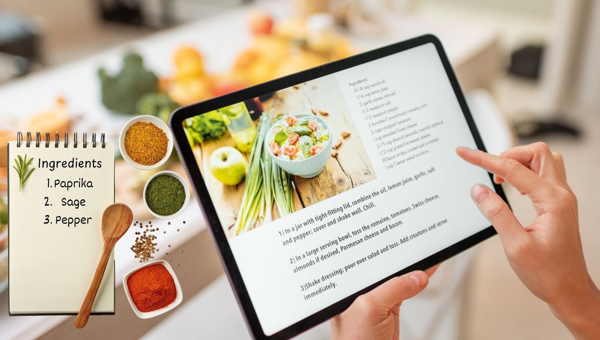 a person holding a tablet with a recipe book on it