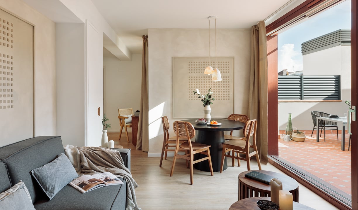 Elegant living room with contemporary design, large windows, wood elements in Barcelona