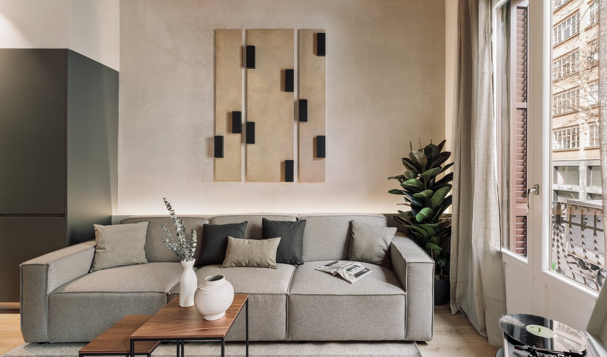 Contemporary Living room with custom art panels, minimalist furniture, neutral tones interior design
