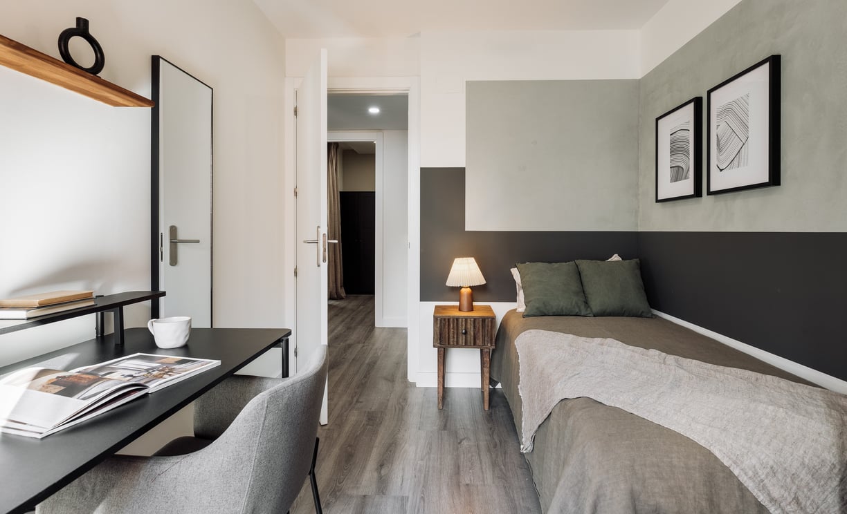 Elegant bedroom with artistic painting, calm color palette and modern minimalist design in Barcelona
