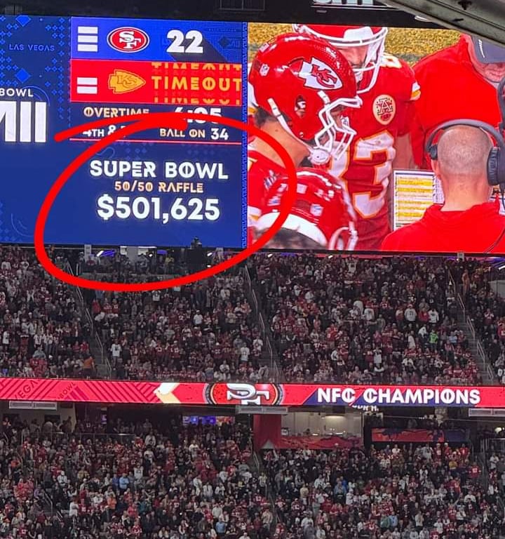 a football player is shown on a large screen