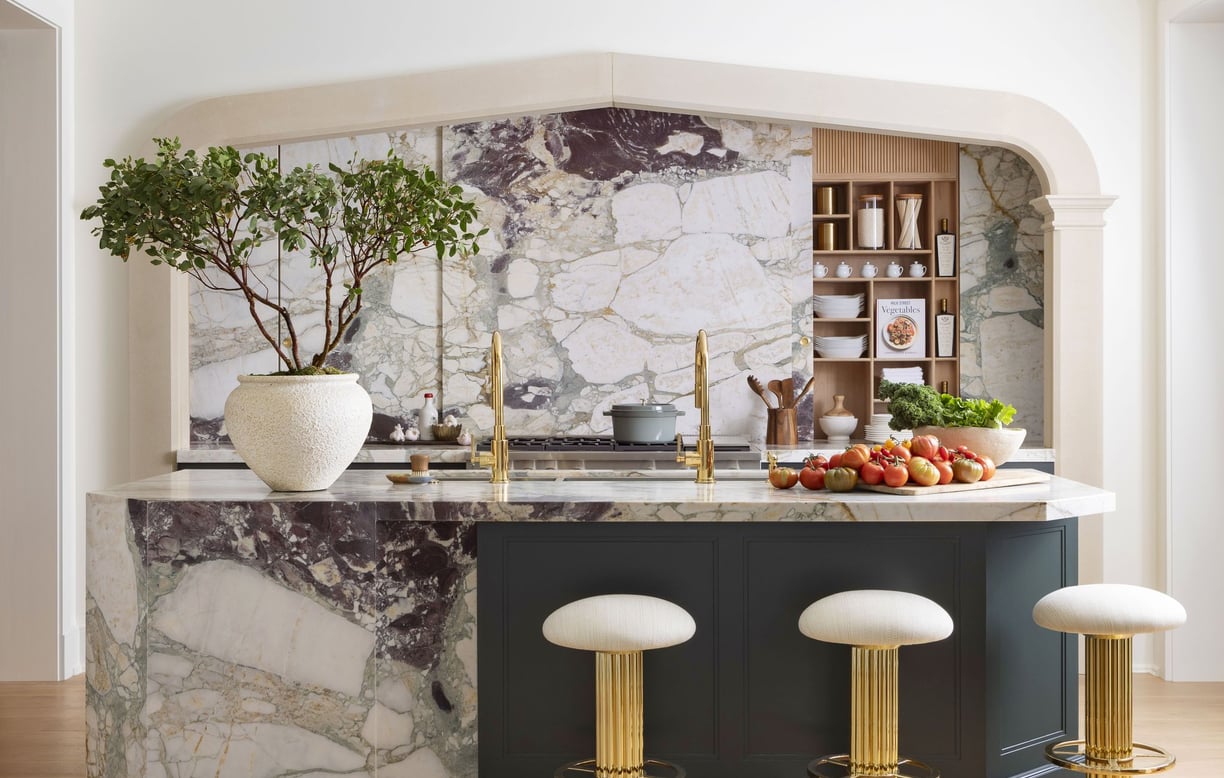 a kitchen with a marbled counter top