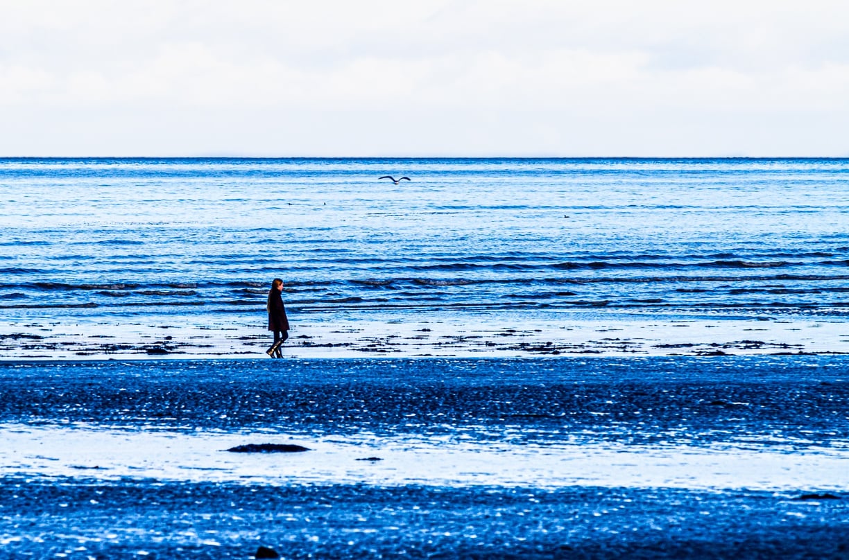 Girl walking on the beach