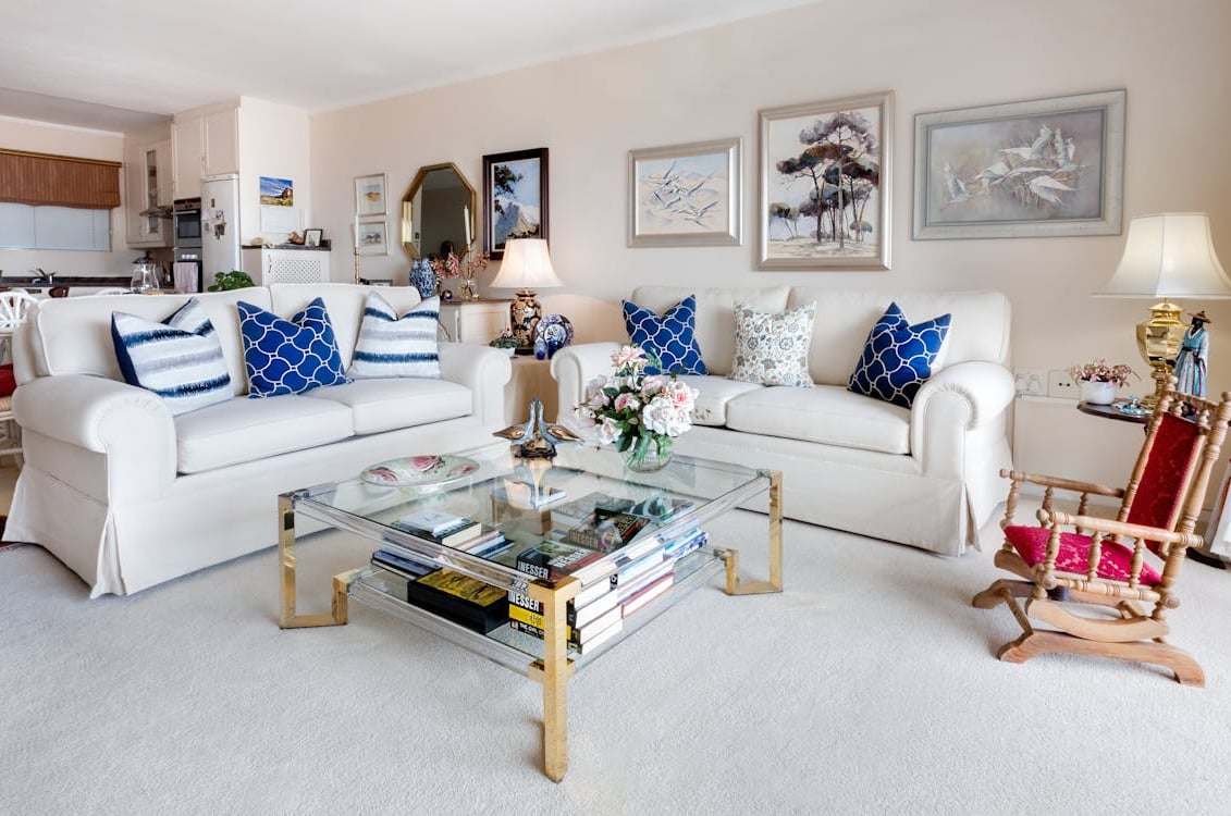 Square Glass Top Coffee Table and Two White Leather 2-seat Sofas by Jean van der Meulen from Pexel