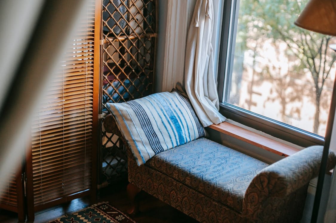 Cozy room with sofa near window by Charlotte May from Pexels